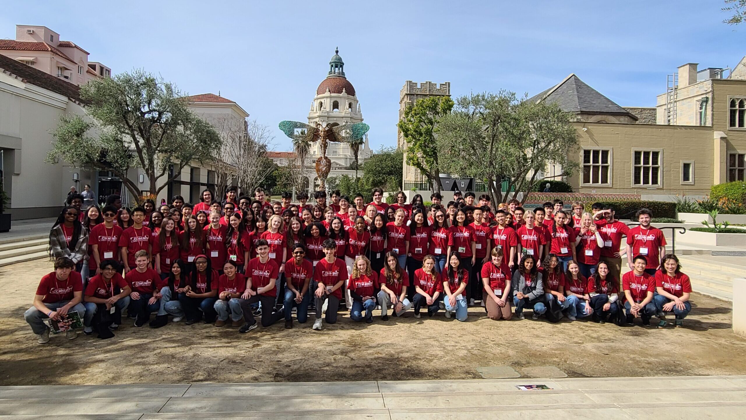 100 CDB Scholars in red T-shirts in front of Pasadena City Hall